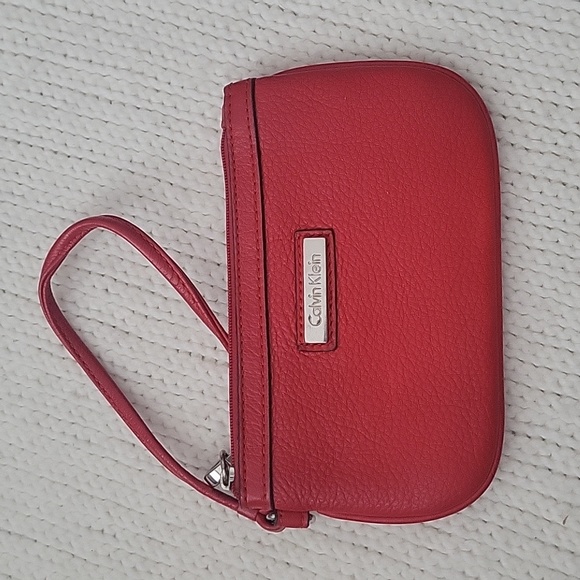 Calvin Klein Handbags - Calvin Klein red clutch zipper pouch